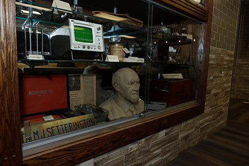 Miscellaneous historical items shown in a glass display case